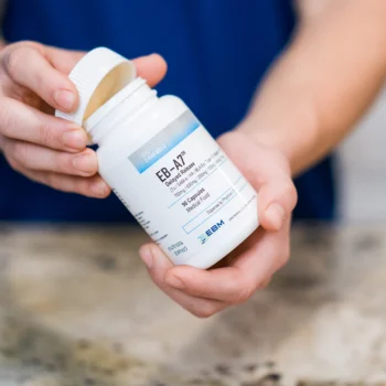 hands holding EB-A7 bottle