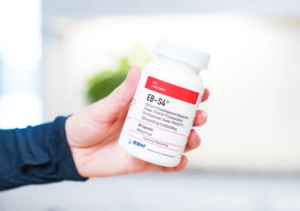 hand holding EB-S4 bottle
